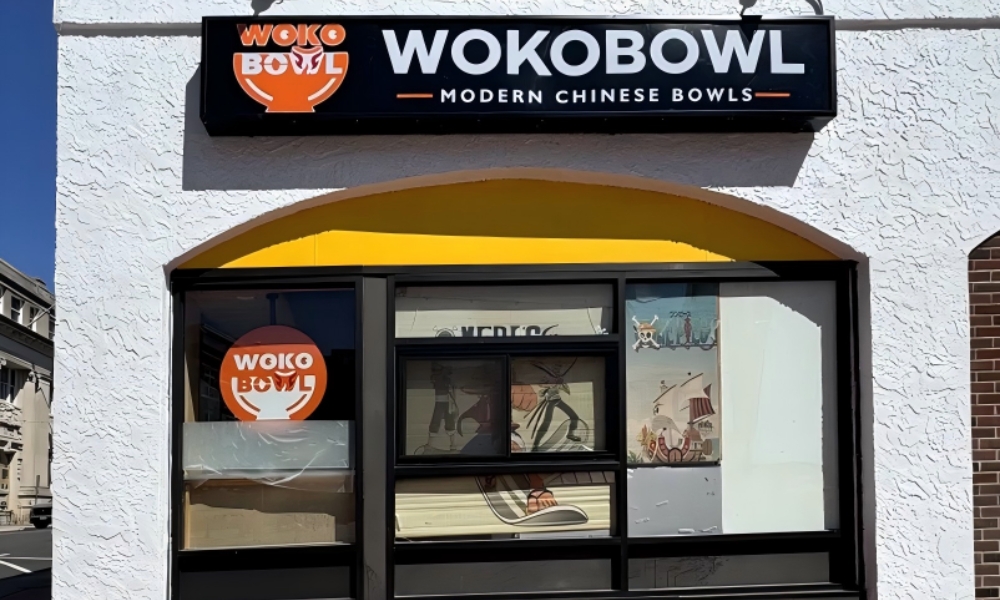 The storefront sign and entrance of WOKOBOWL. at WOKOBOWL, a Chinese Restaurant in Glen Cove