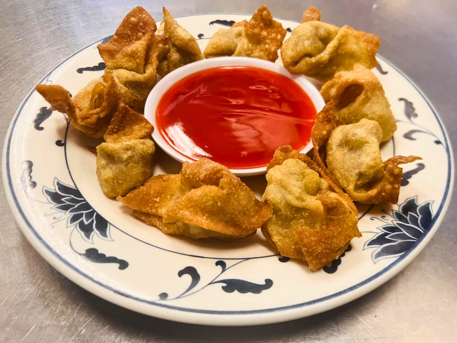 Crispy fried wontons served with sweet chili sauce at Wok's Cookin', a Chinese Restaurant in Castaic