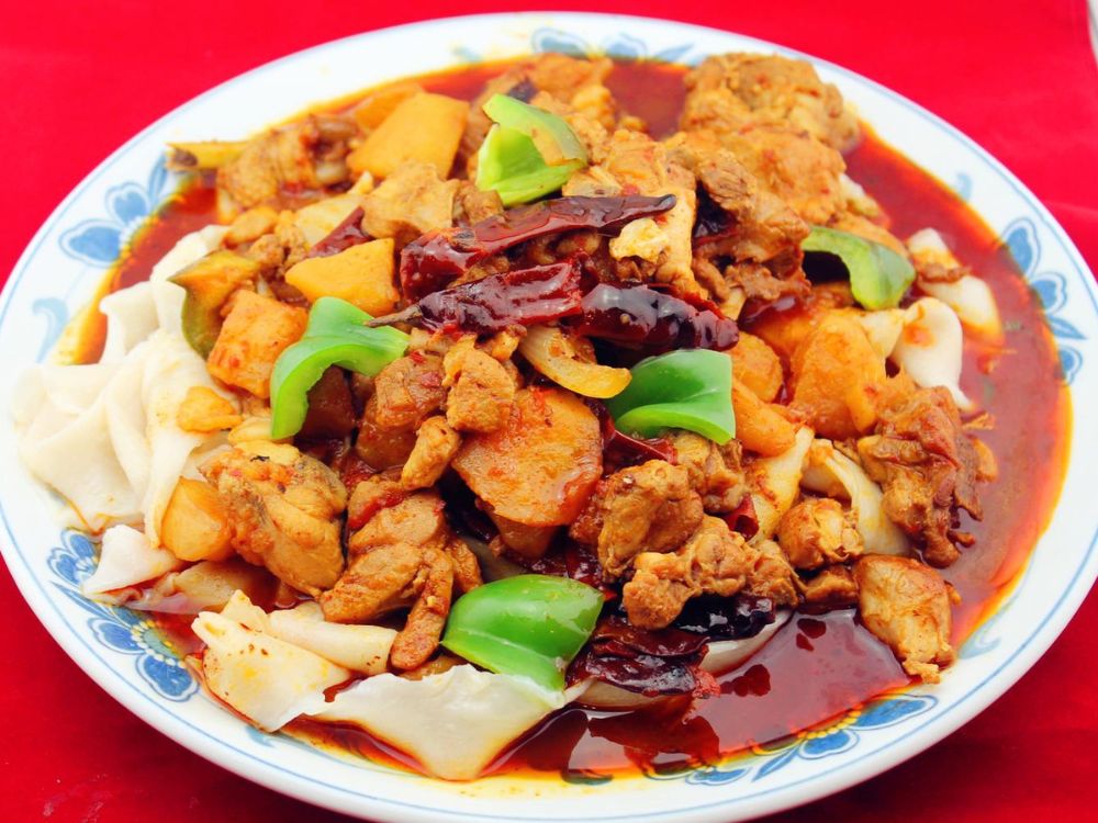 Xi’an-Sizzling-Woks-Chinese-Restaurant-Braised-Chicken-with-Broad-Noodles-Philadelphia Spicy braised chicken with potatoes and broad noodles, served in rich sauce at Xi'an Sizzling Woks, a Chinese Restaurant in Philadelphia
