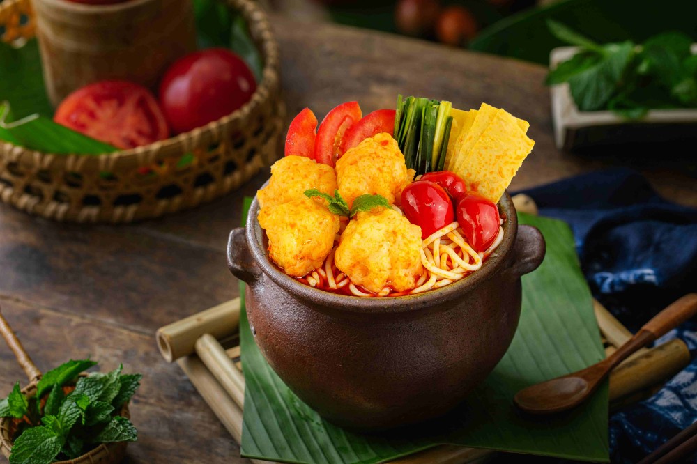 Pickled chili pot rice noodles with meatballs and veggies at Xiaozhan Rice Noodle, a Chinese Noodle Restaurant in Flushing
