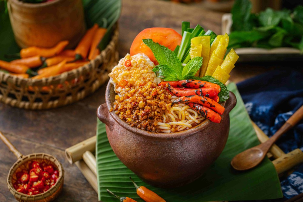 Spicy minced meat pot rice noodles with fresh herbs and veggies at Xiaozhan Rice Noodle, a Chinese Noodle Restaurant in Flushing
