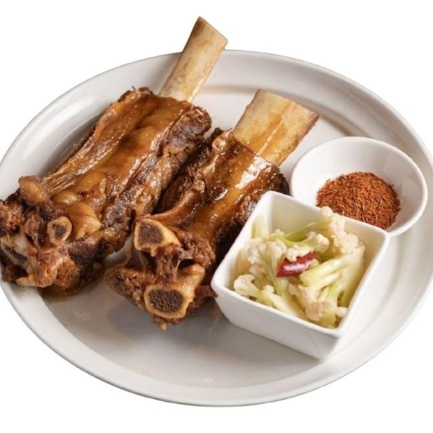 Braised lamb shanks with seasoning and pickled vegetables at XIBEI, a Chinese Restaurant in Arcadia