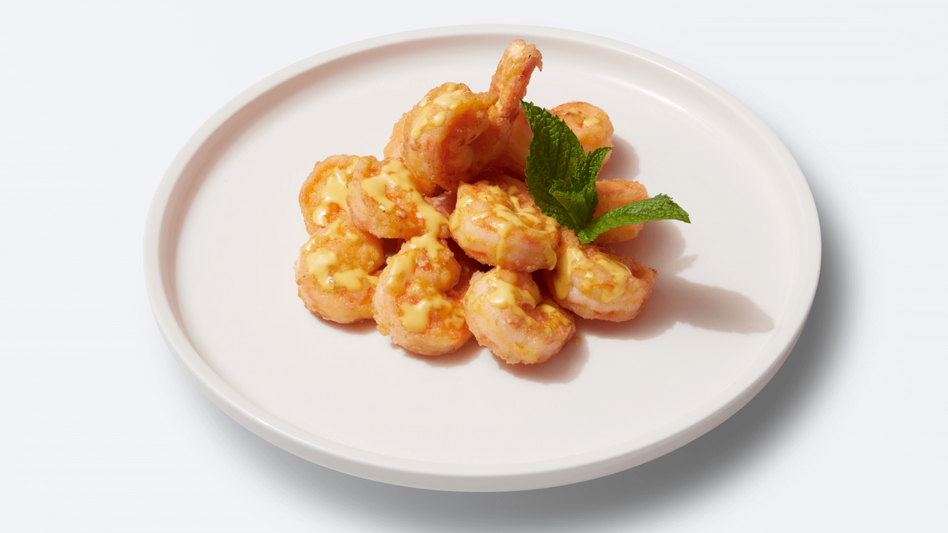 Shrimp with honey mustard sauce and mint garnish at XIBEI, a Chinese Restaurant in Arcadia