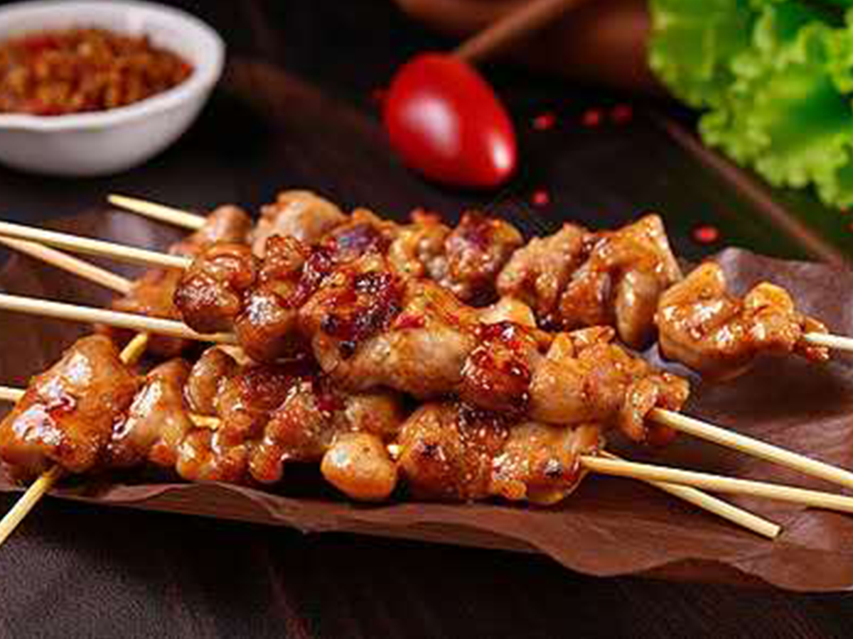 Saucy meat skewers with dip at Xin Jiang BBQ, a Chinese Restaurant in Houston