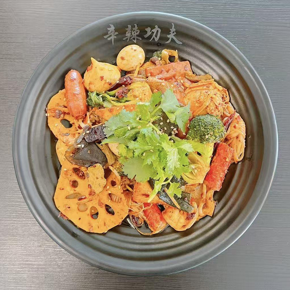 Spicy dry pot malatang with mixed ingredients and cilantro at Xin La Gong Fu, a Malatang Restaurant in Highland Park