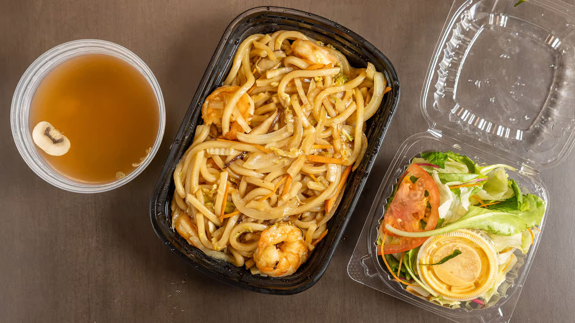 Udon - Stir - fried udon noodles with shrimp, veggies & soup - salad side at Yama Fuji Sushi, a Japanese restaurant in Medway