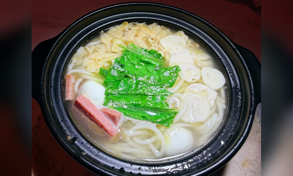 Clear broth potato noodles with ham in clay pot at Yami Bowl, a Asian Fusion Restauran in San Jose