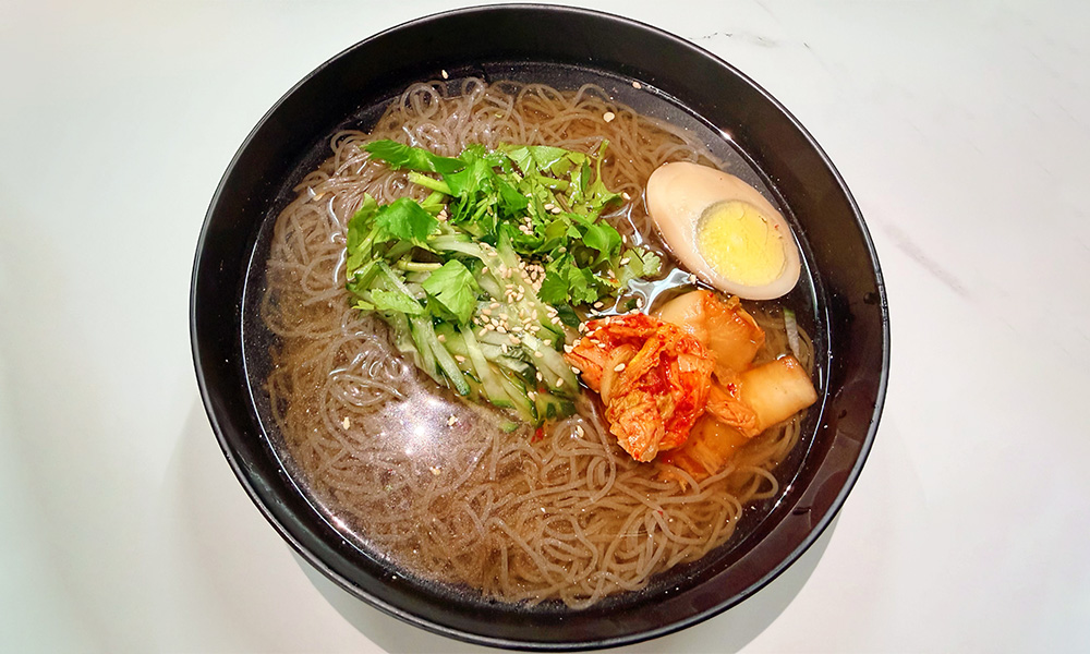 Cold buckwheat noodles with kimchi and egg at Yami Bowl, a Asian Fusion Restauran in San Jose