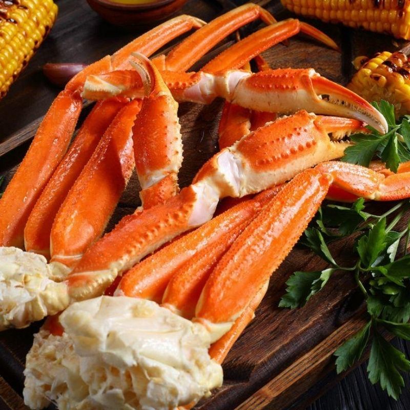 Cooked snow crab legs served with parsley and corn at Yami Buffet, a Buffet Restaurant in Glassboro