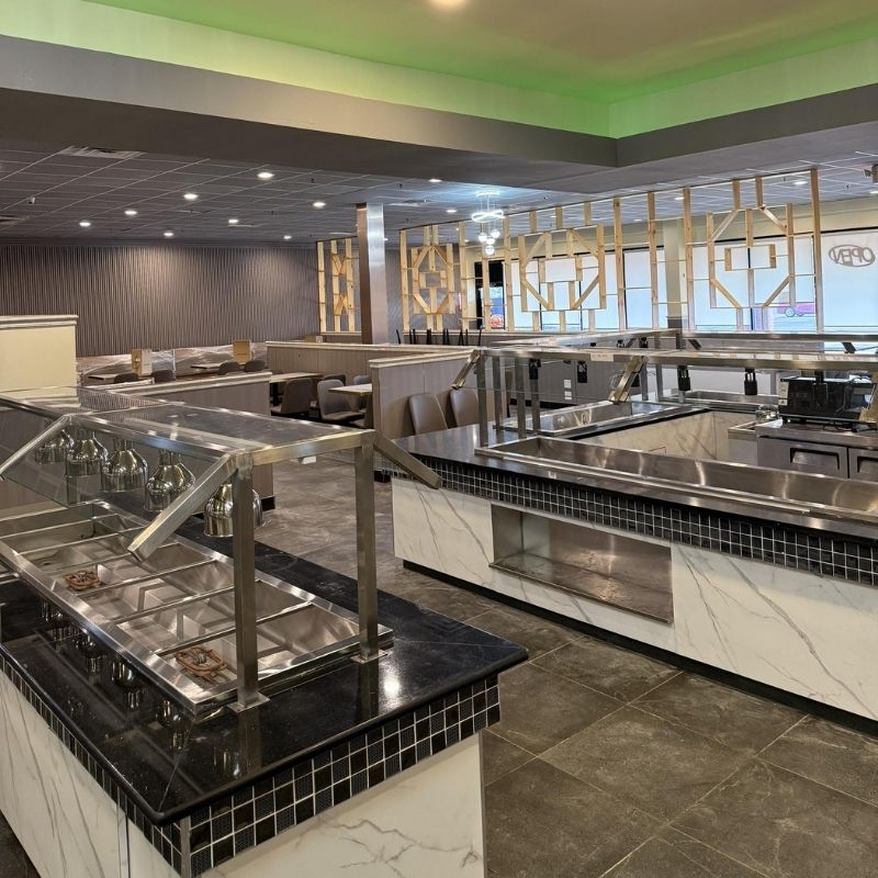 Open buffet food preparation counter with metal trays at Yami Buffet, a Buffet Restaurant in Glassboro
