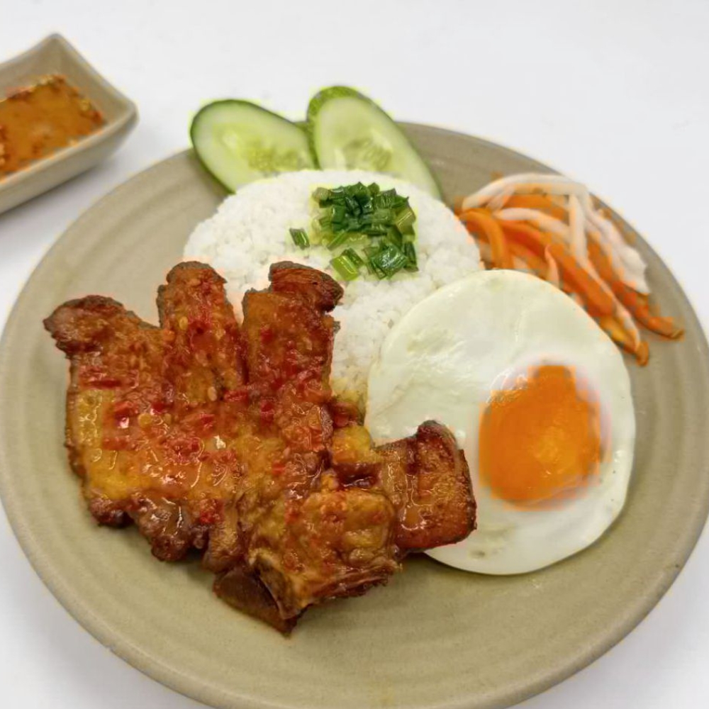 Grilled pork, broken rice, and a fried egg at Yangtze Chinese Restaurant, a Chinese Restaurant in Chardon