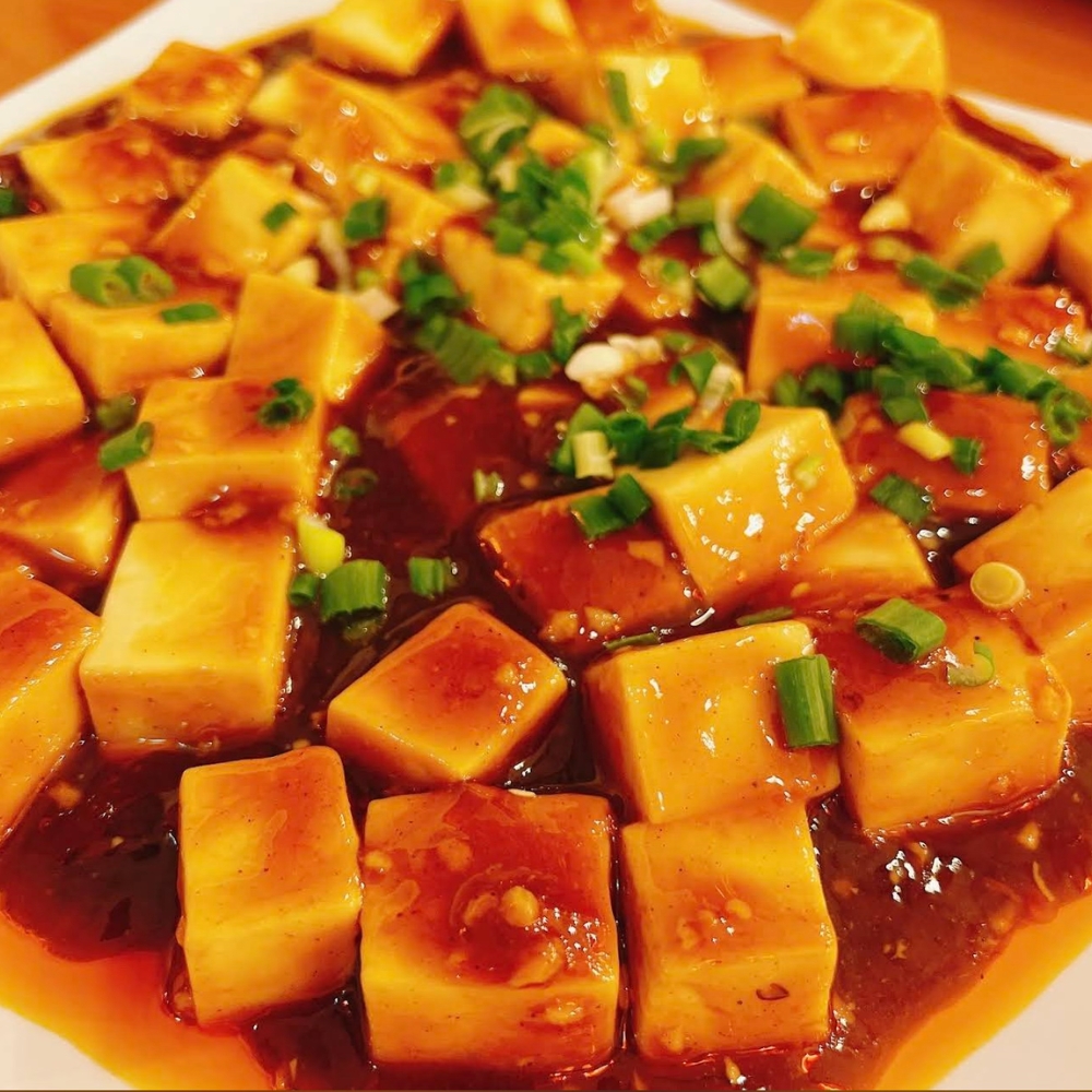 Silky tofu in spicy Sichuan sauce with scallions at Yangtze Chinese Restaurant, a Chinese Restaurant in Chardon.