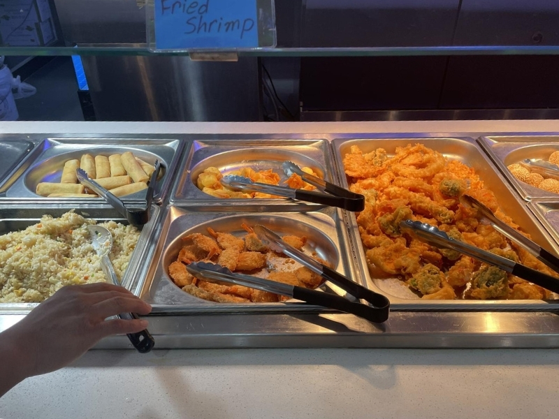 Fried appetizer bar with fried shrimp, rice, and rolls at YC Seafood Hot Pot, a Hot Pot Restaurant in Virginia Beach