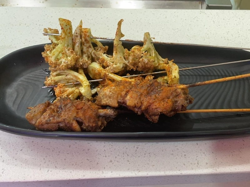 Grilled cauliflower and meat skewers at YC Seafood Hot Pot, a Hot Pot Restaurant in Virginia Beach