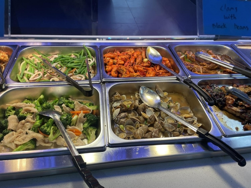 Hot buffet with shrimp, clams, and vegetables at YC Seafood Hot Pot, a Hot Pot Restaurant in Virginia Beach