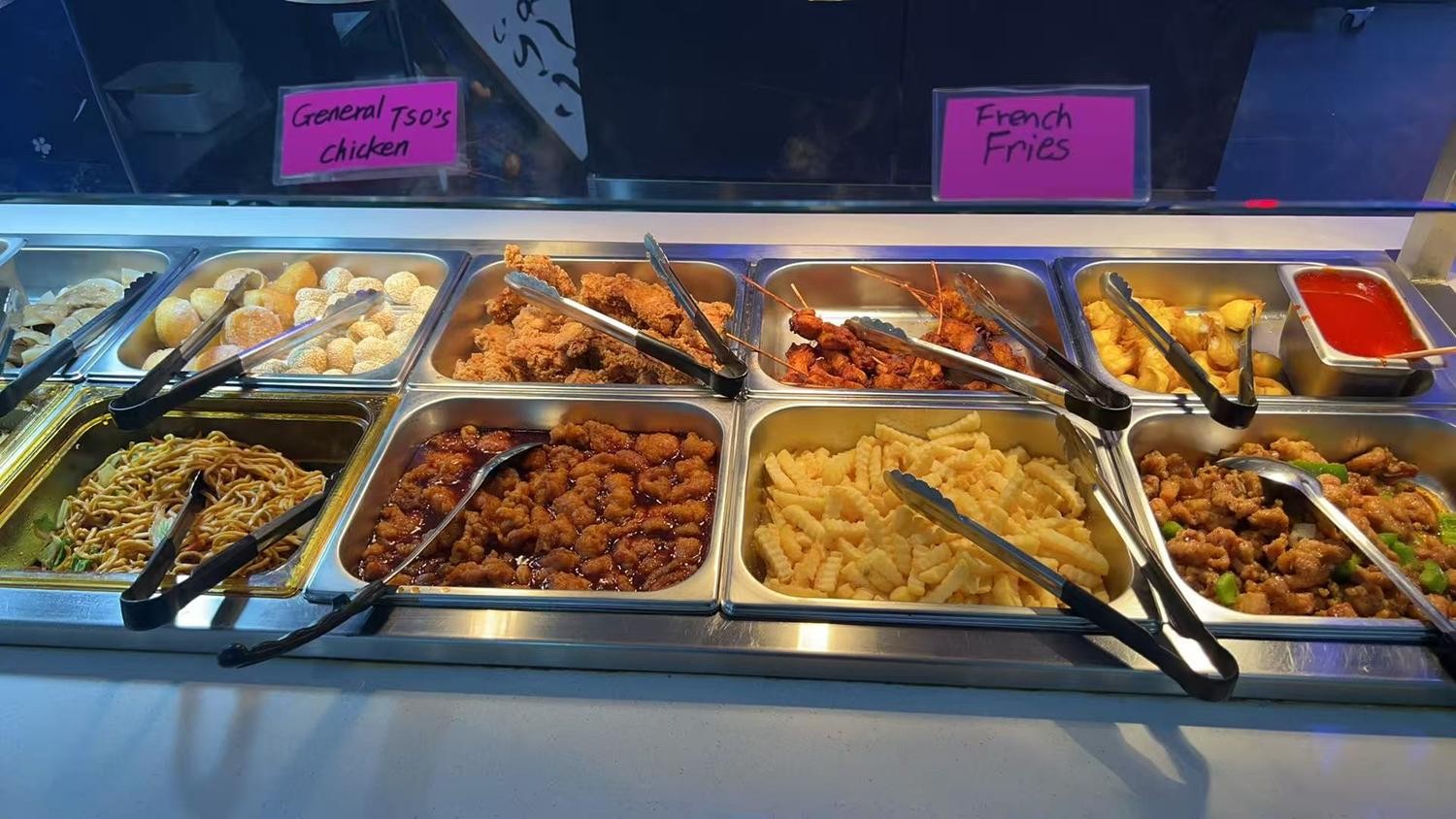 Buffet tray filled with fried chicken, noodles and fries at YC Seafood Hot Pot, a Hot Pot Restaurant in Virginia Beach