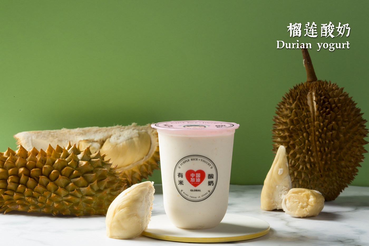Durian yogurt with fresh durian pieces at Yomie's Rice X Yogurt, a Frozen Yogurt Shop in Sugar Land