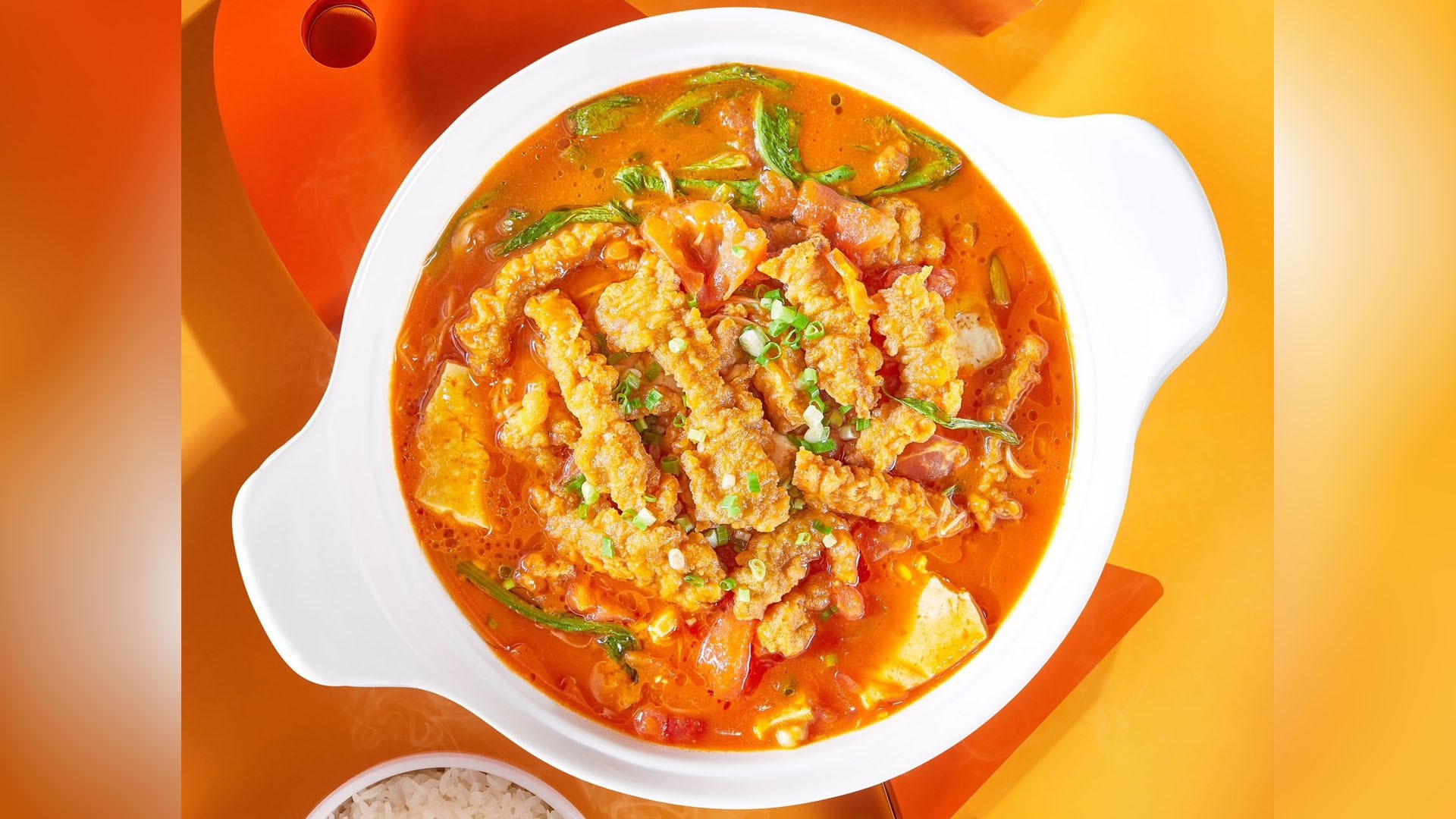 Tomato crispy pork hot pot with fresh veggies at YonnyFish With You, a Chinese Restaurant in Arcadia