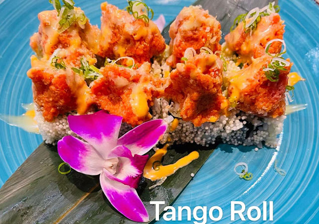 Tango Roll sushi with spicy crispy toppings and orchid at Yosuki Sushi，a Japanese Restaurant in Staten Island