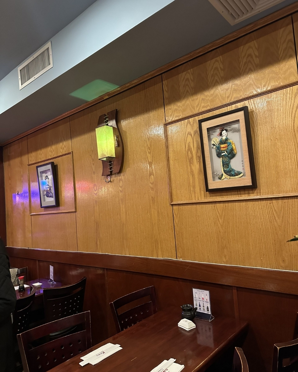 Dining area with Japanese wall art at Yuki Japanese Restaurant, a Japanese Restaurant in New York