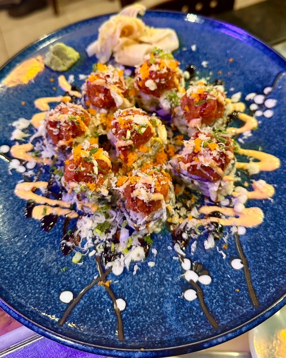 Signature sushi roll with spicy tuna and toppings at Yuki Japanese Restaurant, a Japanese Restaurant in New York