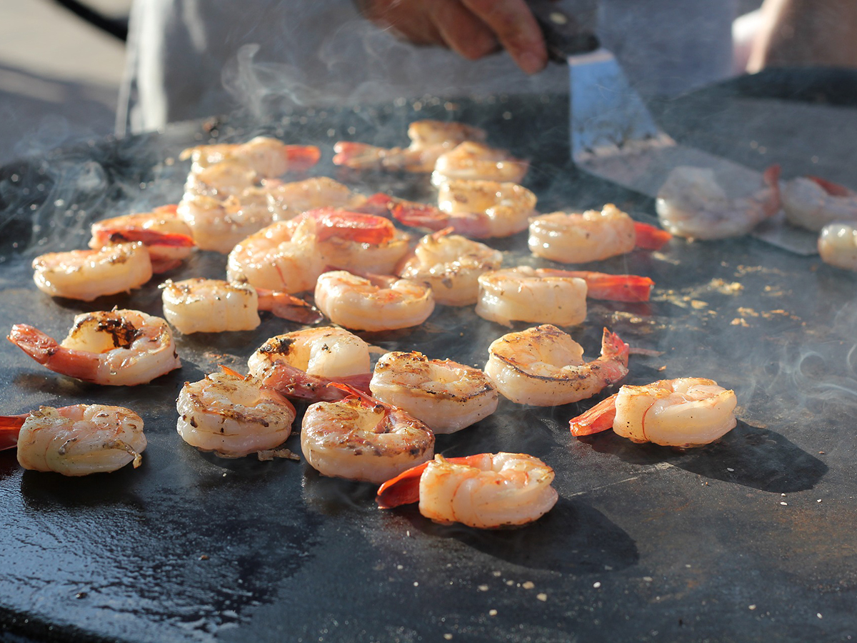 Grilled seasoned shrimp sizzling on a hot flat top grill at YUKI Sushi & Wok, an Asian Fusion Restaurant in Wayne