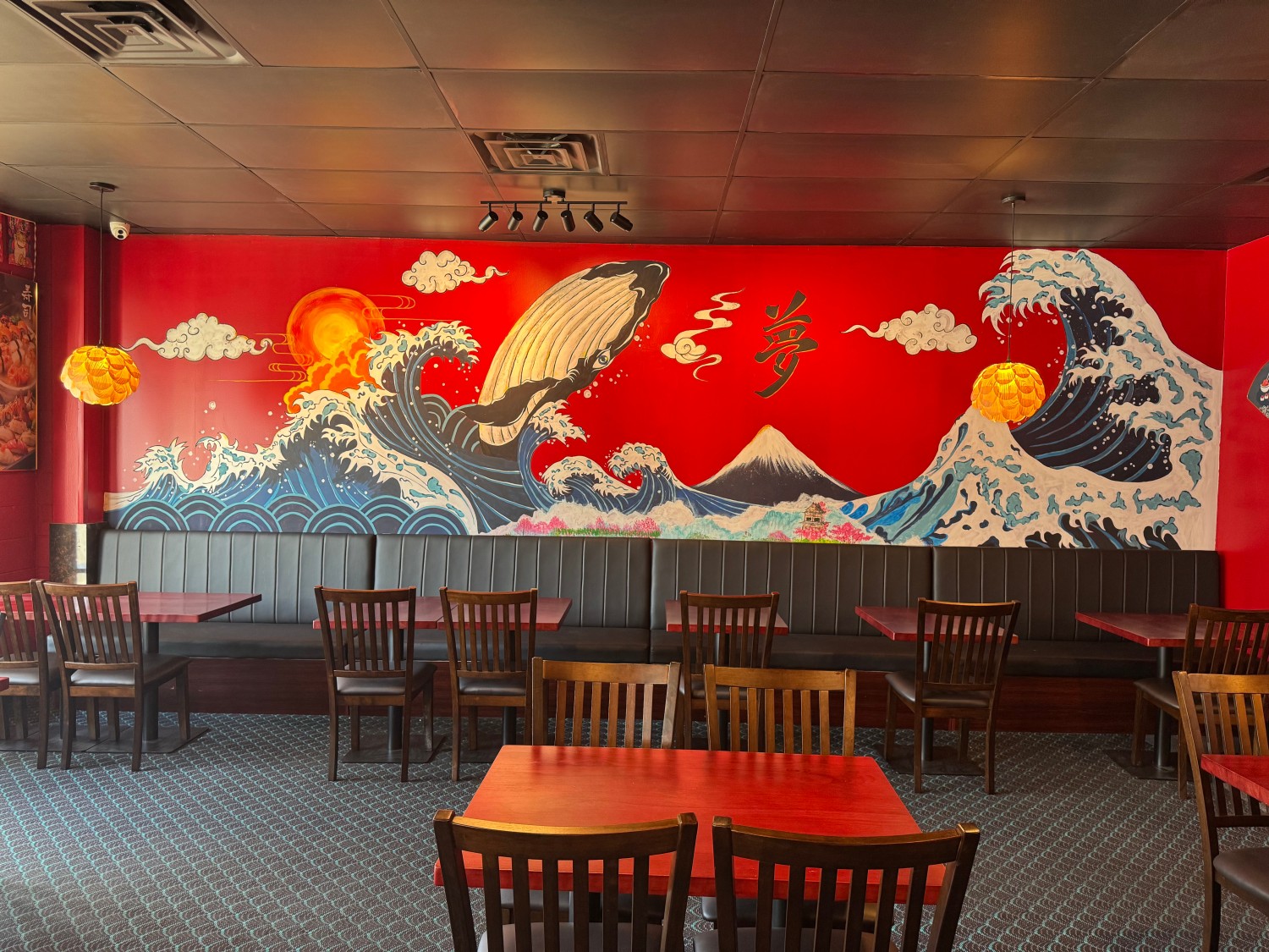 Wall with large wave and whale mural at Yume Sushi, a Sushi Restaurant in Brighton