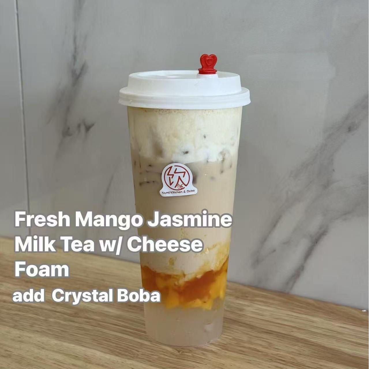 Fresh Mango Jasmine Milk Tea w/ Cheese Foam add Crystal Boba - Mango jasmine milk tea with cheese foam and crystal boba at Yumi Kitchen & Boba, a Asian fusion restaurant in DeLand