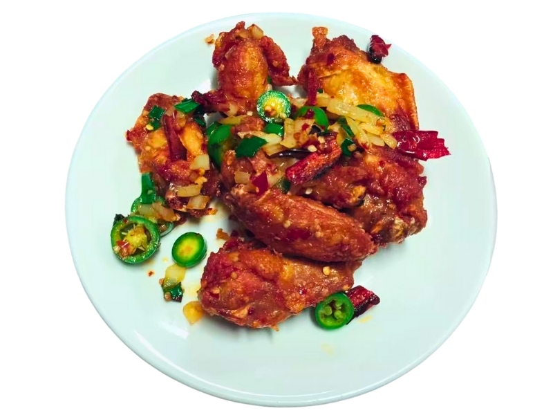Crispy fried chicken wings with chili, jalapeño, and spices at Yumi's kitchen, a Asian Restaurant in Albuquerque