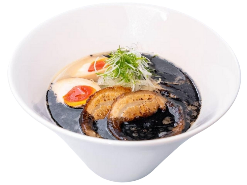 Rich black tonkotsu ramen with chashu, ajitama egg, and greens at Yumi's kitchen, a Asian Restaurant in Albuquerque