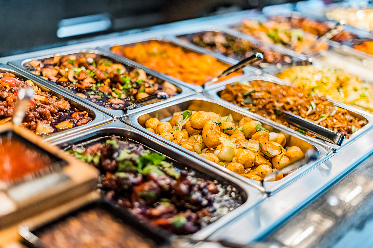 Diverse metal buffet pans filled with asian meat potato and noodle dishes at Yummy Buffet Asian Cuisine, an Asian Restaurant in Sikeston