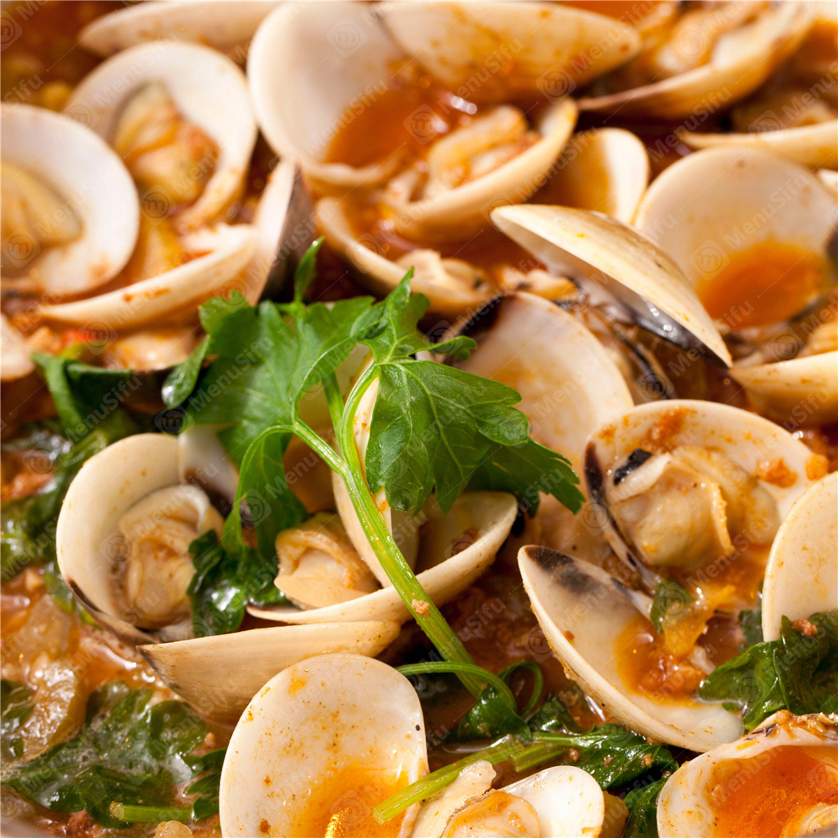 Spicy Clams - Fresh clams cooked in spicy sauce with herbs at Yummy Crab, a Seafood Restaurant in Houston