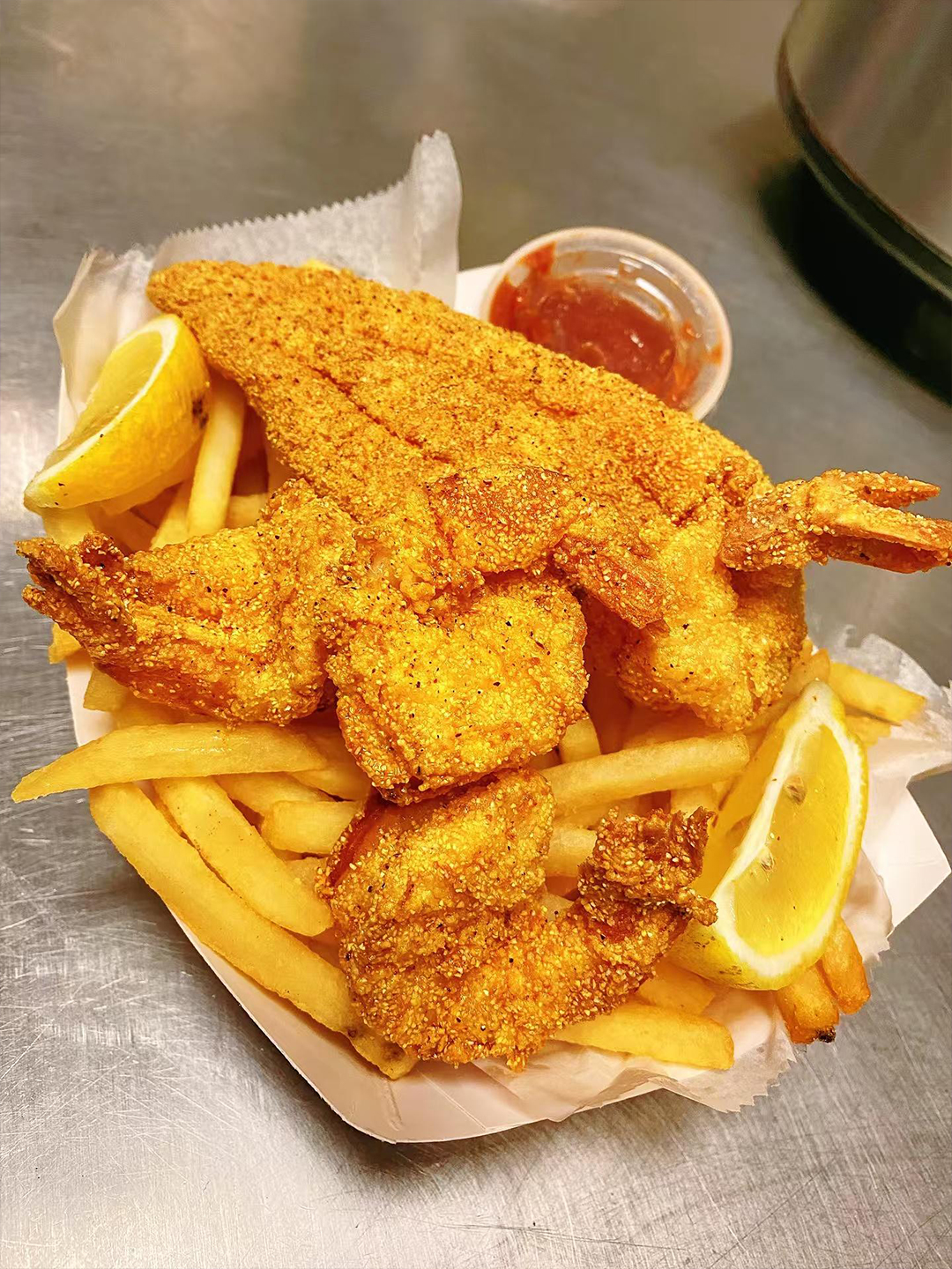 Yummy-Crab-Seafood-Restaurant-Fried-Shrimp-with-Fries-and-Lemon-Charlotte Fried shrimp with fries and lemon from Yummy Crab, a seafood restaurant in Charlotte