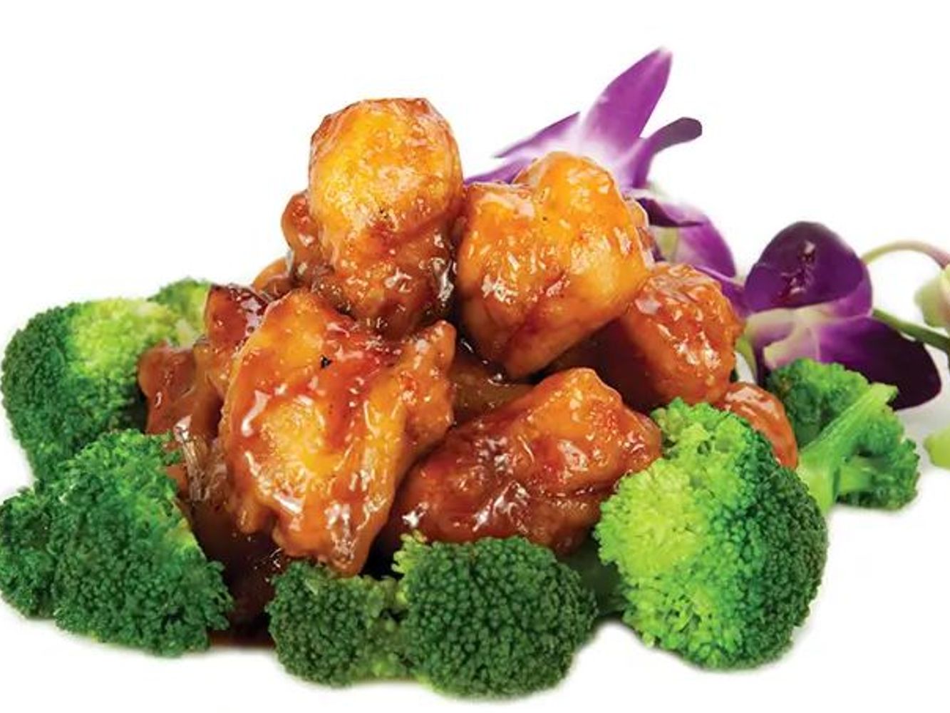 Sweet glazed orange chicken pieces served with broccoli and orchid flower