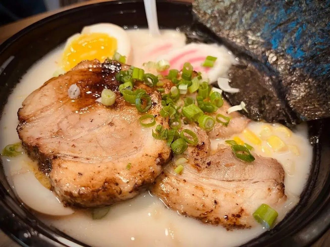 Creamy tonkotsu ramen with chashu pork, soft egg, corn and seaweed