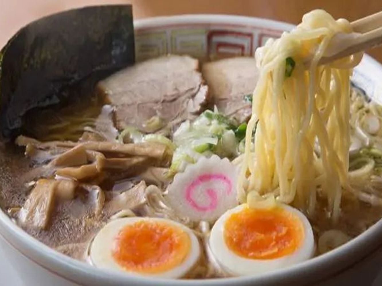 Classic pork ramen with soft-boiled eggs, seaweed and bamboo shoots