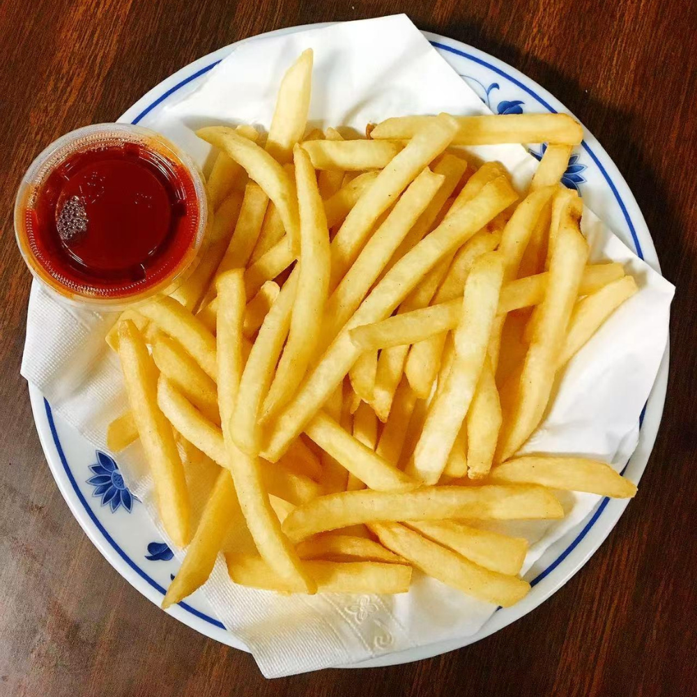 Crispy French fries with ketchup at Yummy House, a Asian Restaurant in Athens.