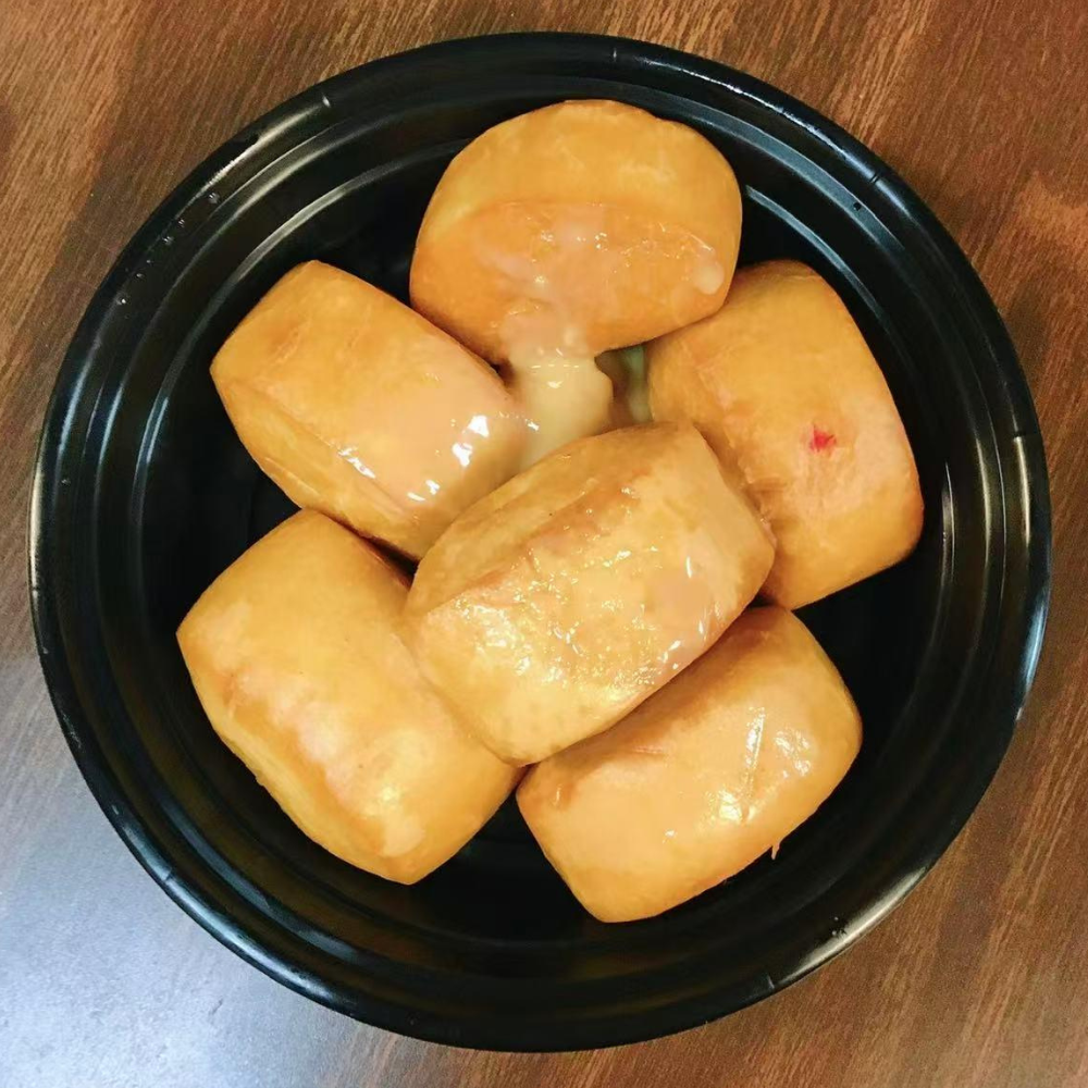 Golden, fluffy fried buns with a sweet sauce at Yummy House, a Asian Restaurant in Athens.