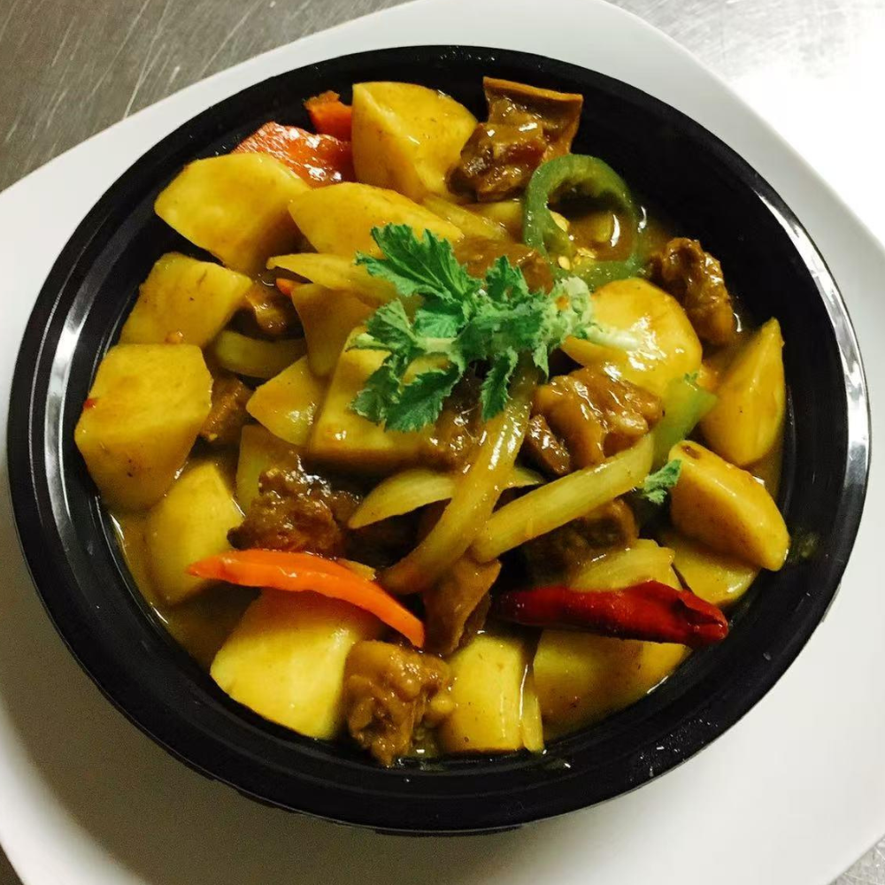 Tender beef in a flavorful yellow curry sauce with mixed vegetables at Yummy House, a Asian Restaurant in Athens.