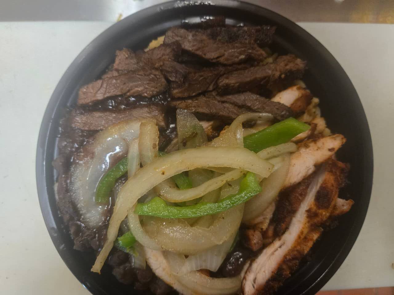 Mexican rice with chicken steak and bean at No.1 Yummy Taco, a Mexican Restaurant in South Ozone Park