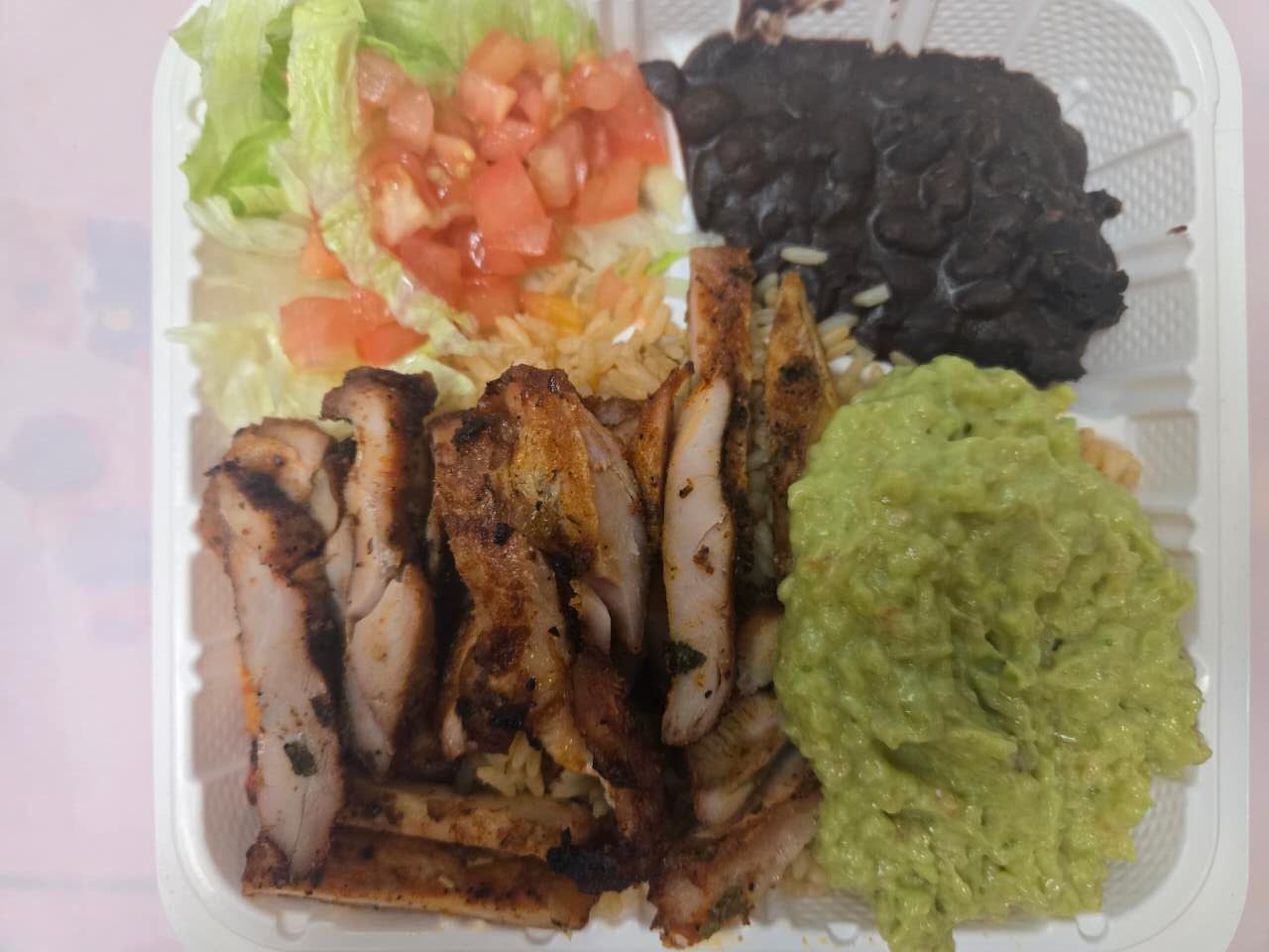 Grilled chicken with guacamole, rice and beans at No.1 Yummy Taco, a Mexican Restaurant in South Ozone Park