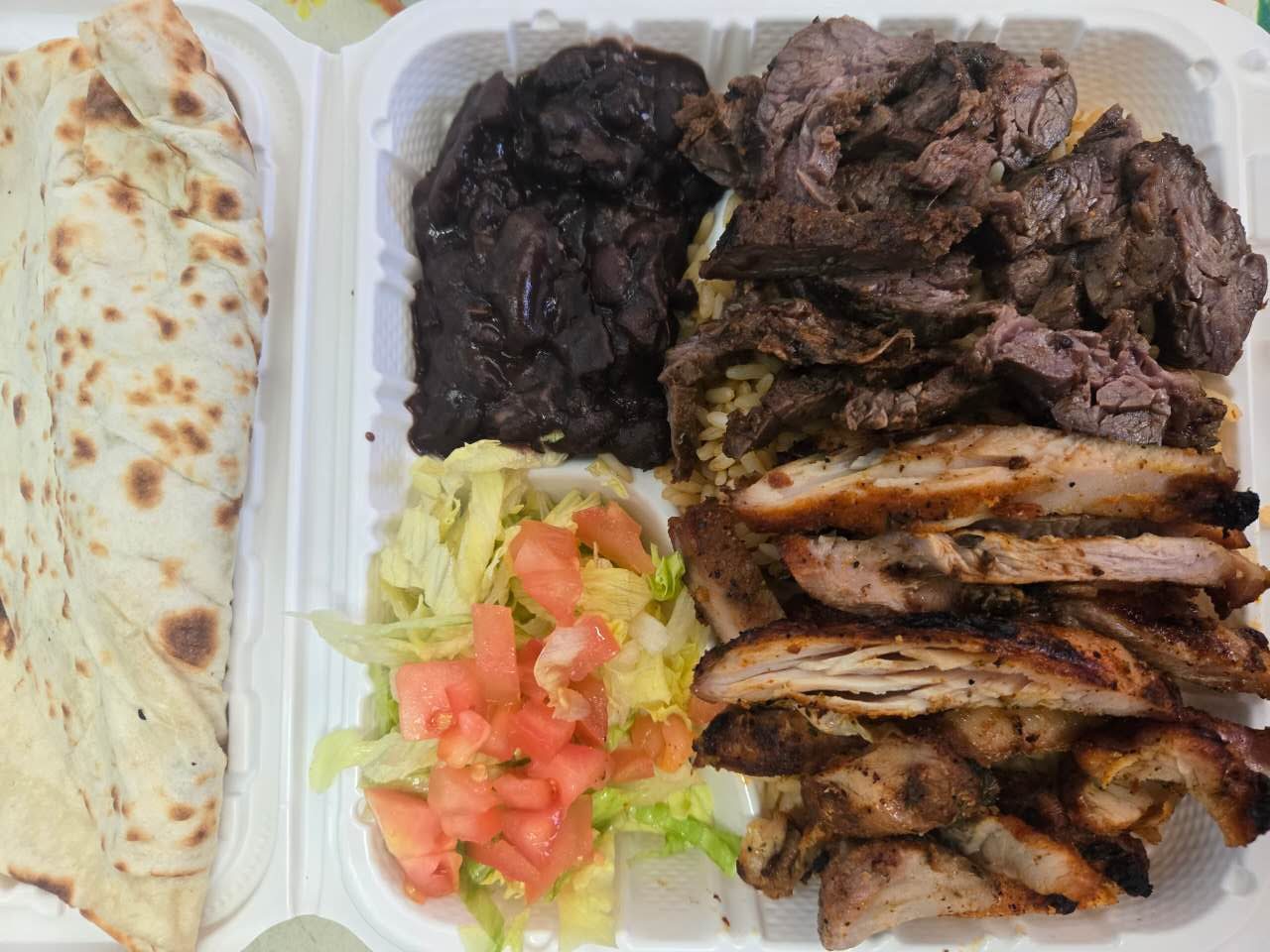 Grilled chicken and steak with rice, beans and salad at No.1 Yummy Taco, a Mexican Restaurant in South Ozone Park