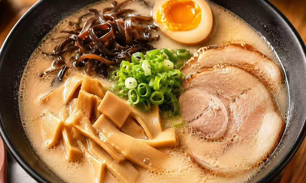 Rich tonkotsu ramen with chashu, menma, wood ear mushrooms, and green onions at Yu San, a Japanese Restaurant in East Stroudsburg