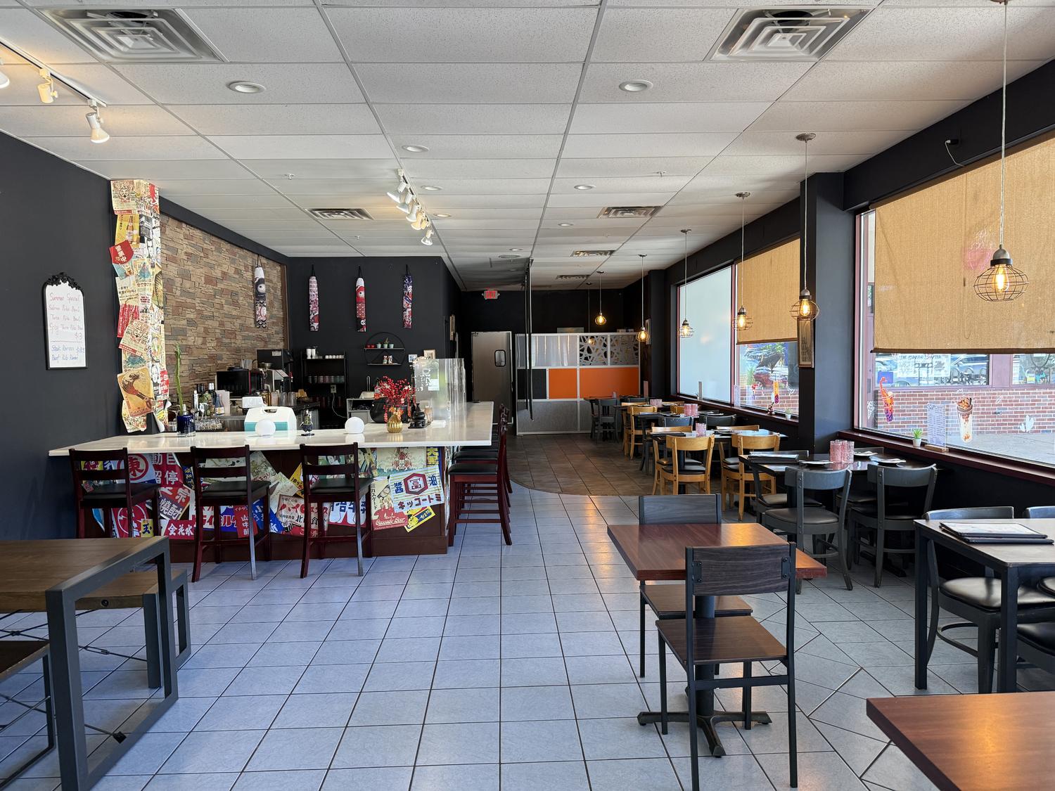 Bright dining room with large windows and Japanese decor wall at Zen Ramen, a Japanese Restaurant in Madison