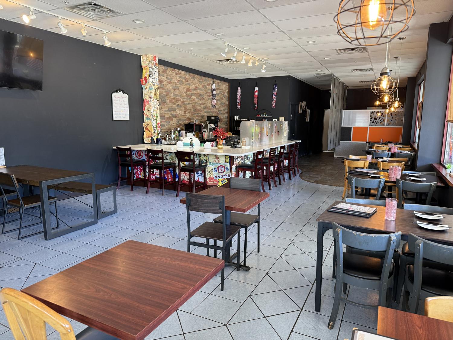 Spacious tidy dining space with bar counter and mixed seating at Zen Ramen, a Japanese Restaurant in Madison