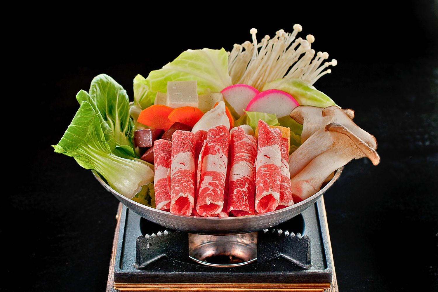Raw beef roll hot pot platter full of mushrooms, bok choy, radish and assorted greens at ZhangLiang Malatang - Corona, a Chinese Restaurant in Corona