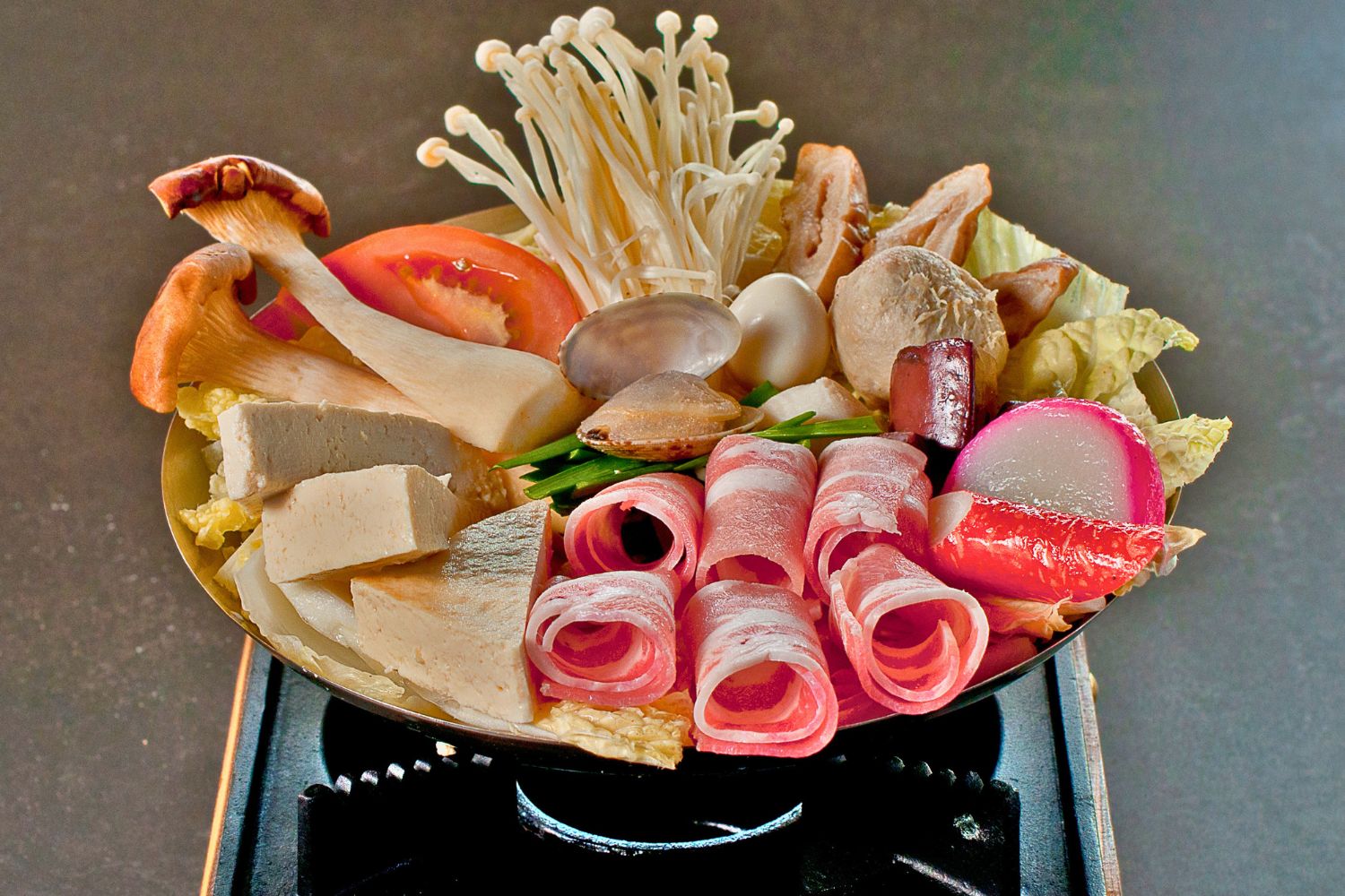 Raw hot pot platter with pork belly, clams, mushrooms, tofu, quail egg and mixed vegetables at ZhangLiang Malatang - Corona, a Chinese Restaurant in Corona