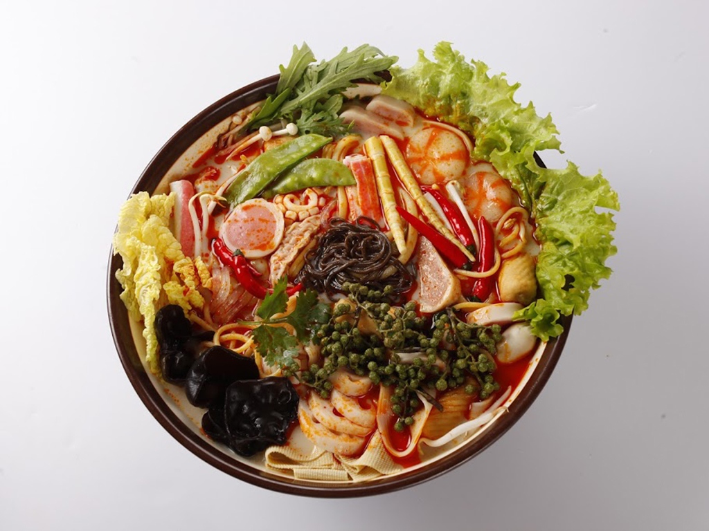 Spicy Sichuan mala pot with fresh greens, meat and flavorful broth at Zhangliang Malatang, a Chinese Restaurant in Mountain View