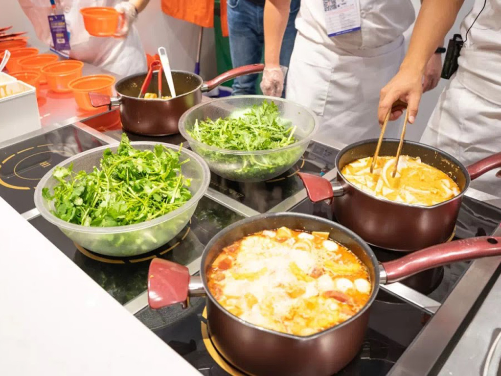 Freshly cooked mala soup with fragrant broth and crisp greens on site at Zhangliang Malatang, a Chinese Restaurant in Mountain View