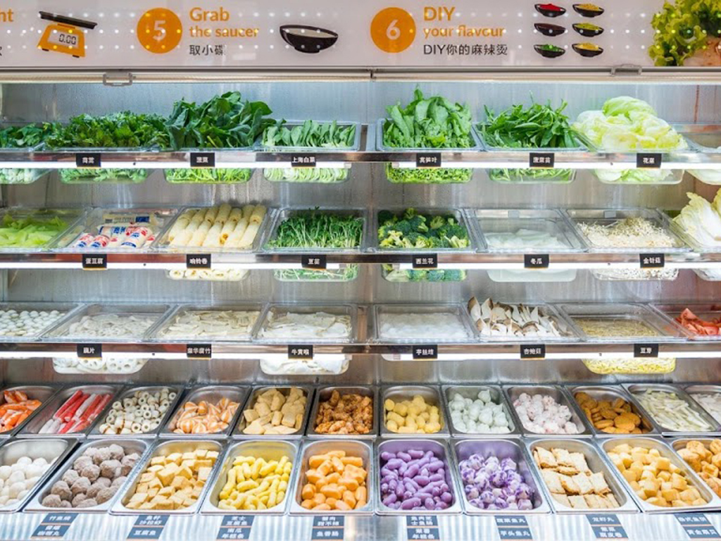 Self-service fresh ingredient bar with diverse veggies and toppings for DIY mala at Zhangliang Malatang, a Chinese Restaurant in Mountain View